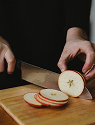 A SHARP KNIFE & CHOPPING BOARD