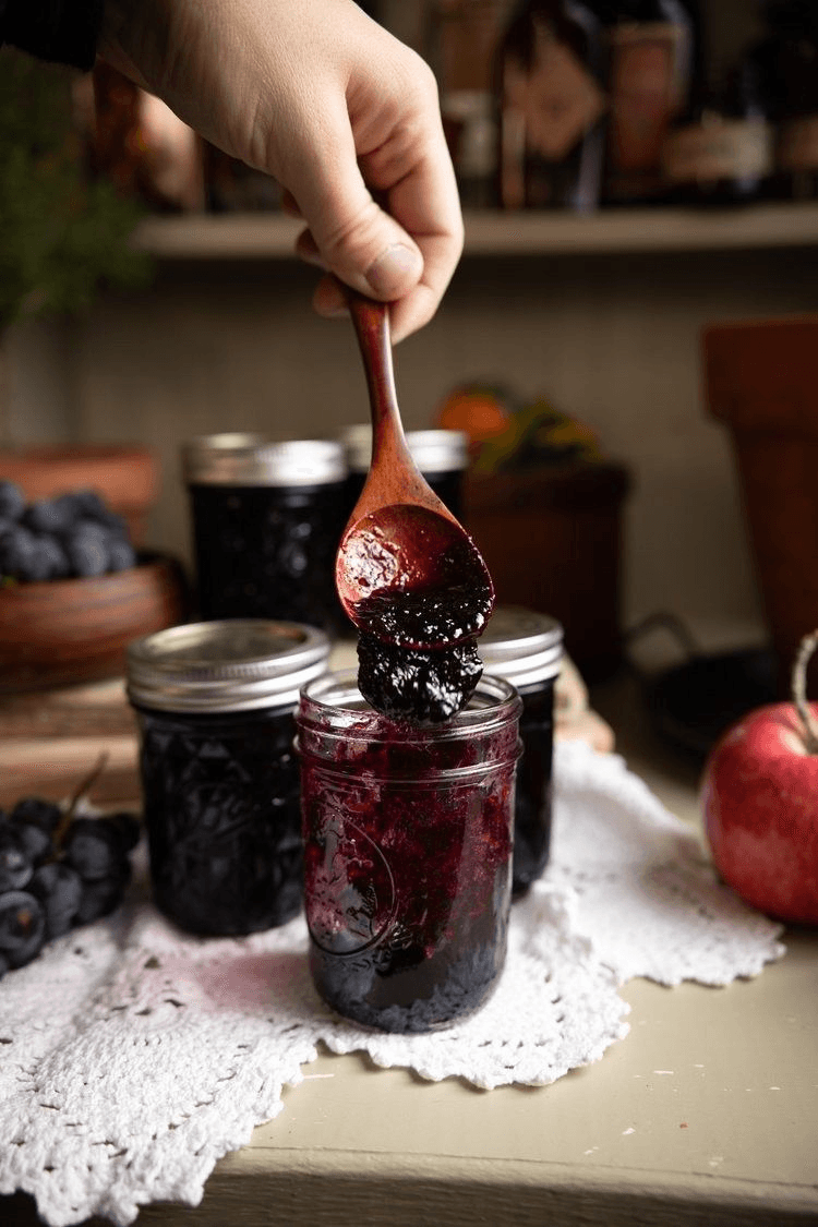Jam being put in jar