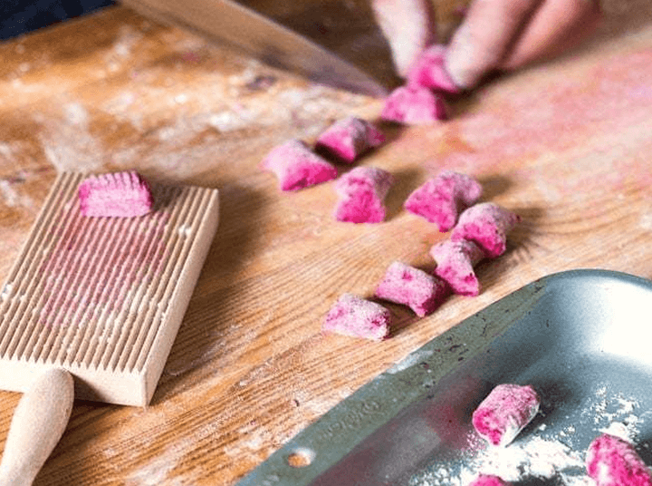 Hands preparing fresh pasta